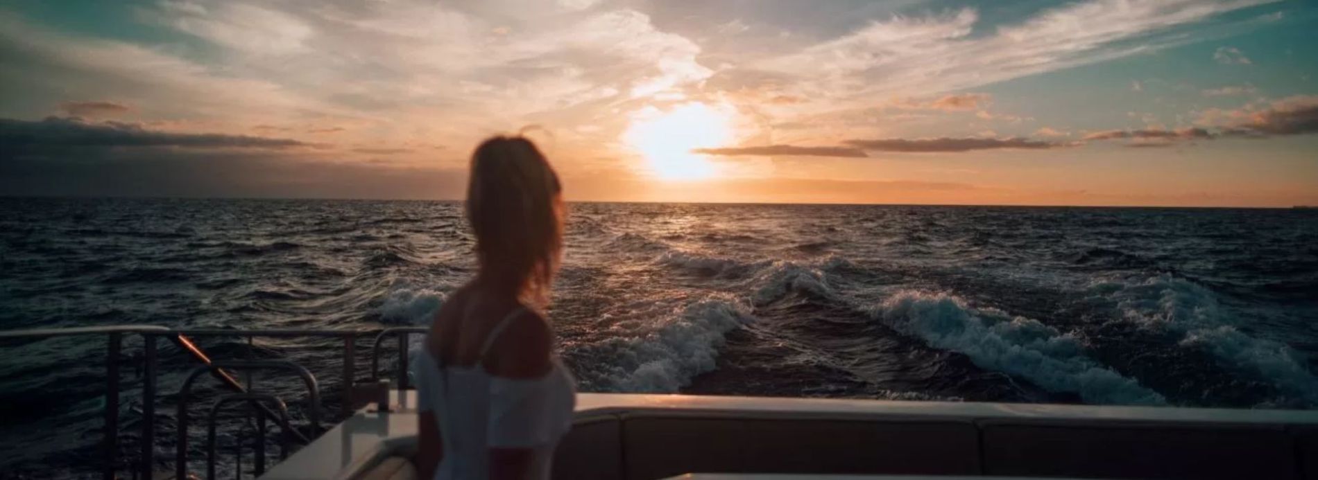 Woman on sunset cruise