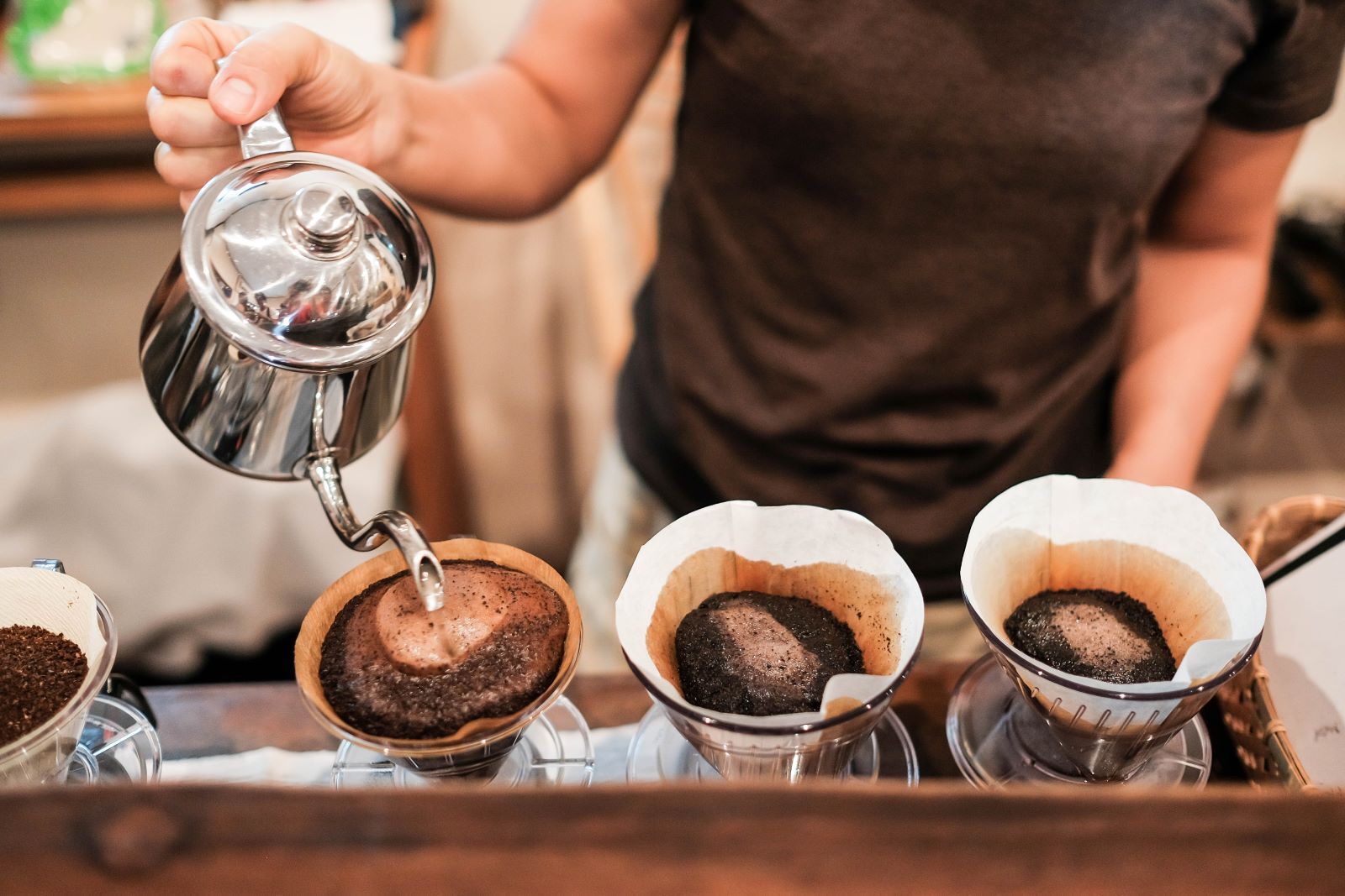 coffee shop employee making pour-over coffee in kauai hawaii