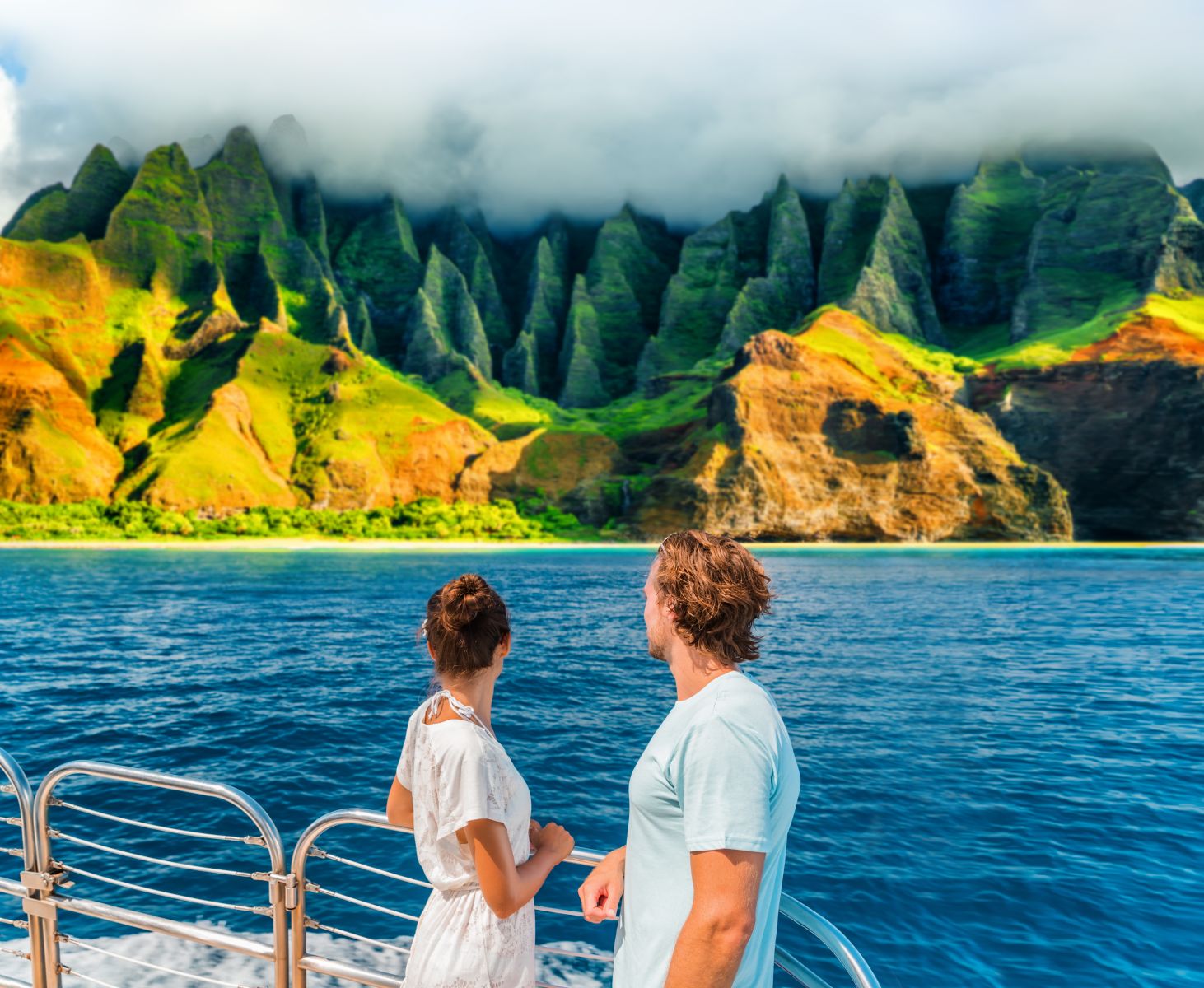 couple enjoying the view on a Hawaiian boat tour. 